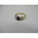 14ct yellow gold ring set with oval cut sapphire on diamond set shoulders, stamped 14k, size J, 3.0g