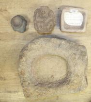 Circa 3/4th century stone mixing bowl 14x12x7cm, a small stone trough and two card stone figures