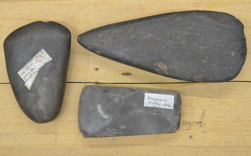 Three neolithic stone and flint hand axe heads, largest L17cm (Victor Brox collection)
