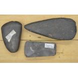 Three neolithic stone and flint hand axe heads, largest L17cm (Victor Brox collection)