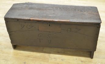 18th century planked oak coffer with hinged moulded top, front carved 1707 GS TY, W95cm D35cm