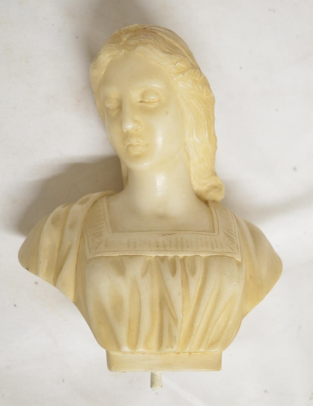 Carved alabaster female bust, marked J Raphael to rear, with base mounting peg. H18cm (Victor Brox