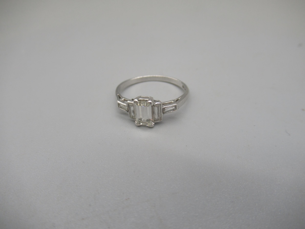 Platinum ring set with central emerald cut diamond, flanked by two baguette cut diamonds, stamped - Image 3 of 6