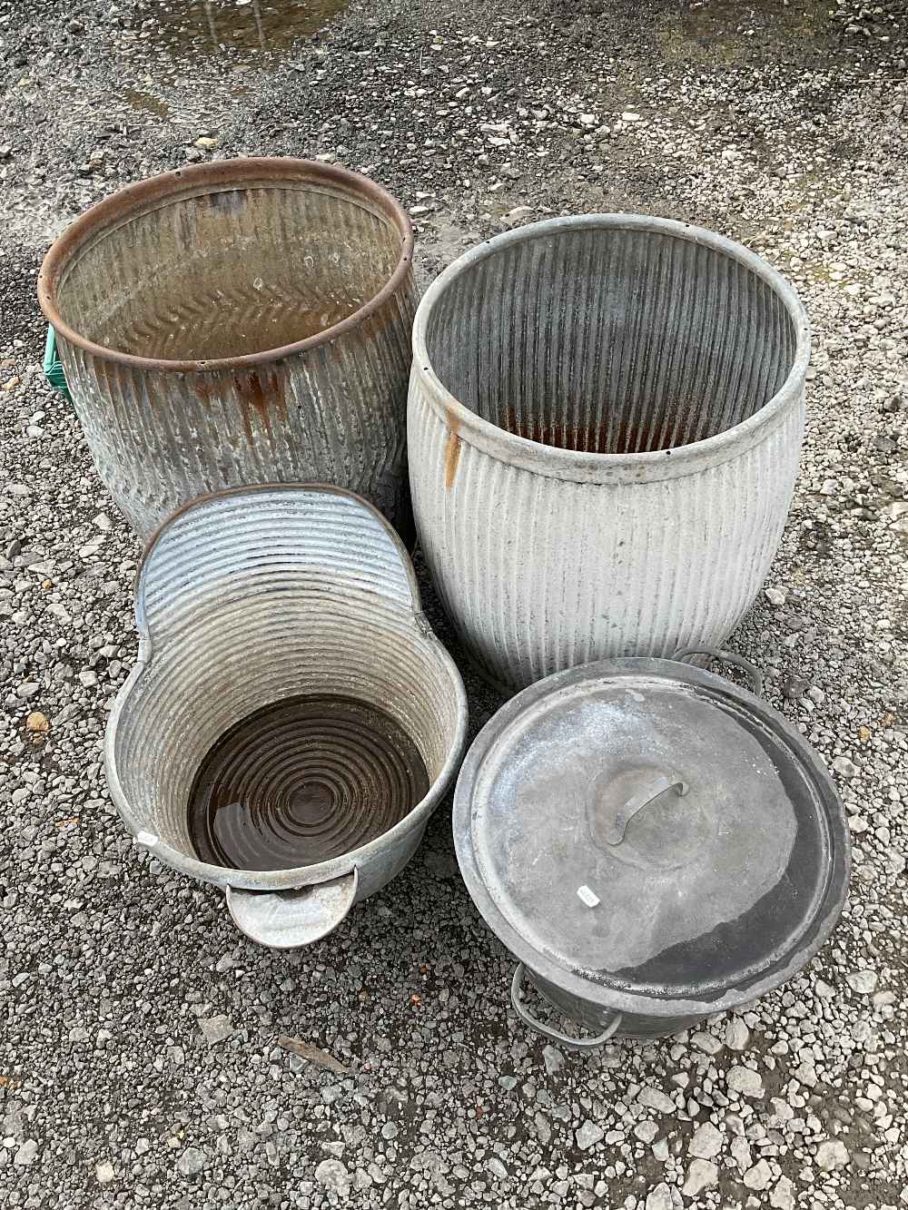 Four metal bins for use as planters or garden décor to include two wash basins and 2 dolly tubs