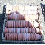 (Large quantity). Two crates of circa 1930s terracotta plant pots. Sizes 5 and 5 1/2 inch