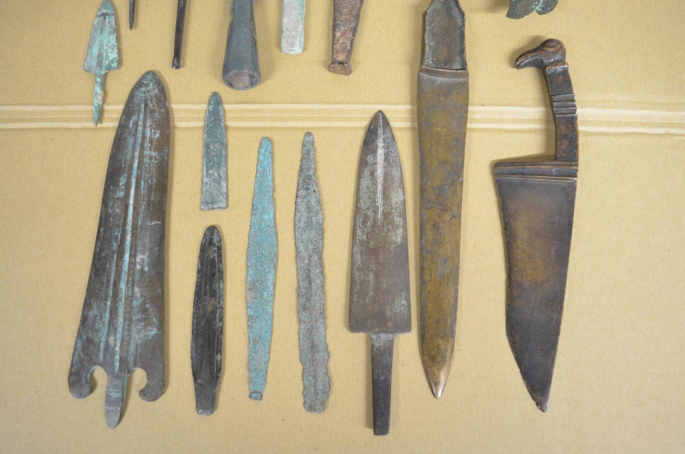 Collection of ancient Greek and Roman copper and bronze knives, spear and arrow heads, a double - Image 2 of 3