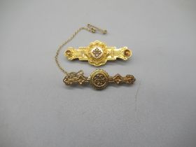 Two Victorian 9ct yellow gold Etruscan style bar brooches, one set with seed pearls, both stamped