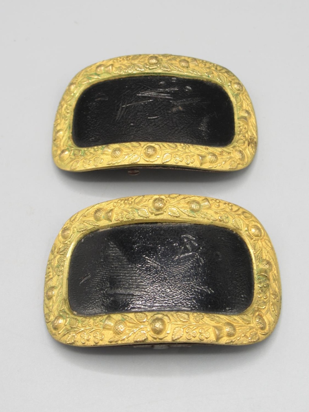 Pair of 19th century gilt metal dress shoe buckles decorated in relief with roses, thistles and