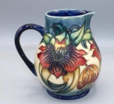 Moorcroft Pottery, Anna Lily pattern jug, designed by Nicola Slaney, H15cm