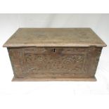 Oak table box, moulded hinged top above floral carved front with traces of old paint, W61cm D34cm