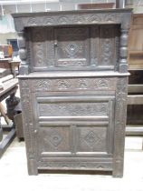 Small oak court cupboard, with lozenge caved panels, arcades and stylized foliage, W94cm D46cm