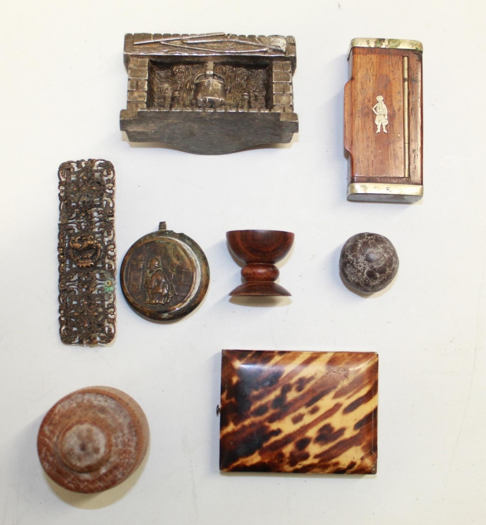 An assortment of small boxes and other items. To include a 'peeping-tom' snuff dispenser, a wooden