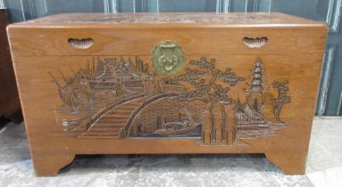 Chinese camphor lined blanket box carved with landscapes, brass lock on bracket feet, W101cm D50cm