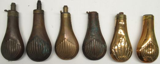 Six 19th century copper and brass embossed powder flasks, decorated with leaf motifs, 20cm