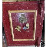 Large Victorian cast iron safe, red painted with gilt detail and brass makers plaque 'J.