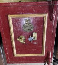 Large Victorian cast iron safe, red painted with gilt detail and brass makers plaque 'J.