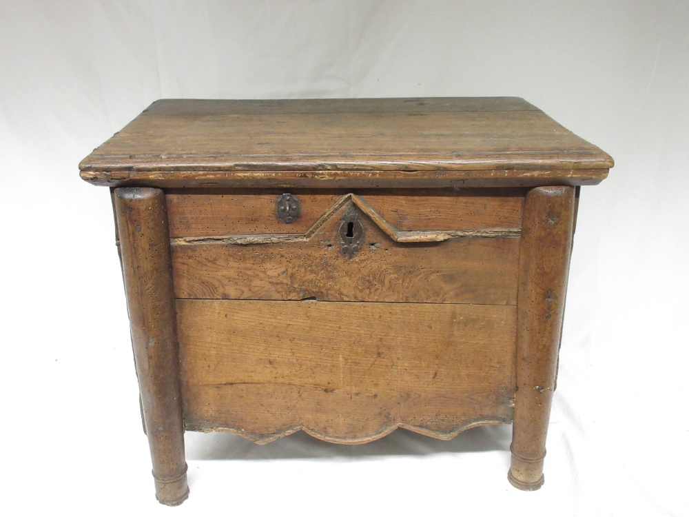 Small French oak and elm box, hinged top above moulded front with shaped frieze, turned supports,