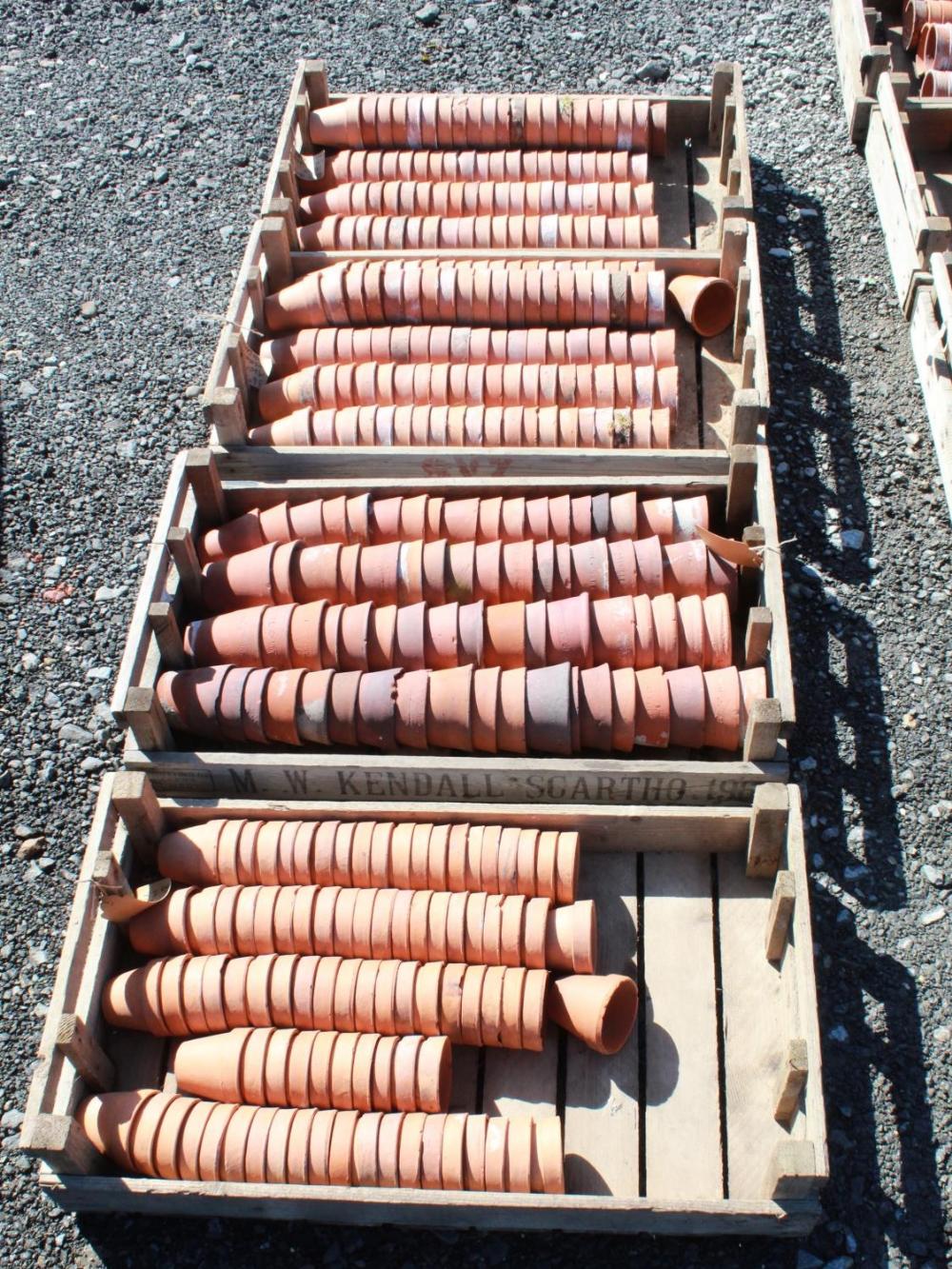 (Large quantity). Four crates of circa 1940s terracotta plant pots. Sizes 3 inch and 3 1/2 inch
