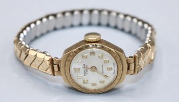 WITHDRAWN - Ladies Excalibur gold wristwatch on gold plated expanding bracelet, signed silvered sun