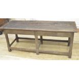 Oak refectory style dining table, rectangular two piece top on six faceted supports joined by