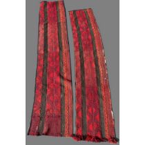 Pair of 20th century red ground Caucasian wool runners with central geometric repeating zig zag pa