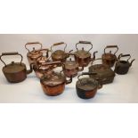 Victorian oval copper kettle, H29cm; four similar and six Victorian copper kettles all with acorn
