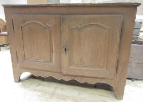 C19th French oak side cabinet, with two arched panel doors on shaped feet, W144cm D53cm H98cm (