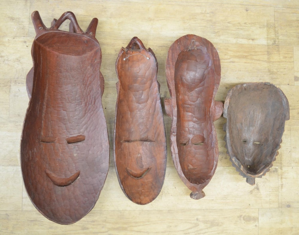 A selection of four carved wooden masks of various styles and time-periods, most likely - Bild 2 aus 2