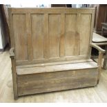 19th century Country made pine box settle, five panel back, shaped arms and lifting seat, W153cm