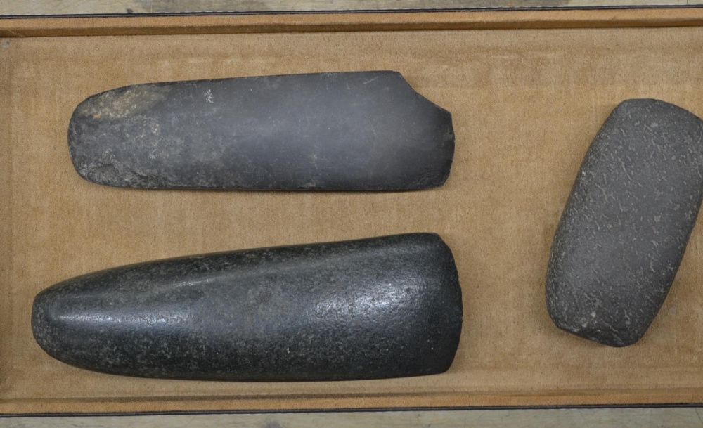 Three neolithic stone hand axe heads, largest L18cm (Victor Brox collection)