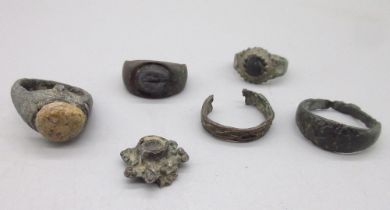 Bronze Roman ring set with cabochon beige stone (approx. C2nd AD), another bronze Roman ring set