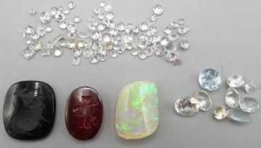 WITHDRAWN Two unmounted intaglios, a quantity of untested gemstones, and an opal. (Victor Brox colle