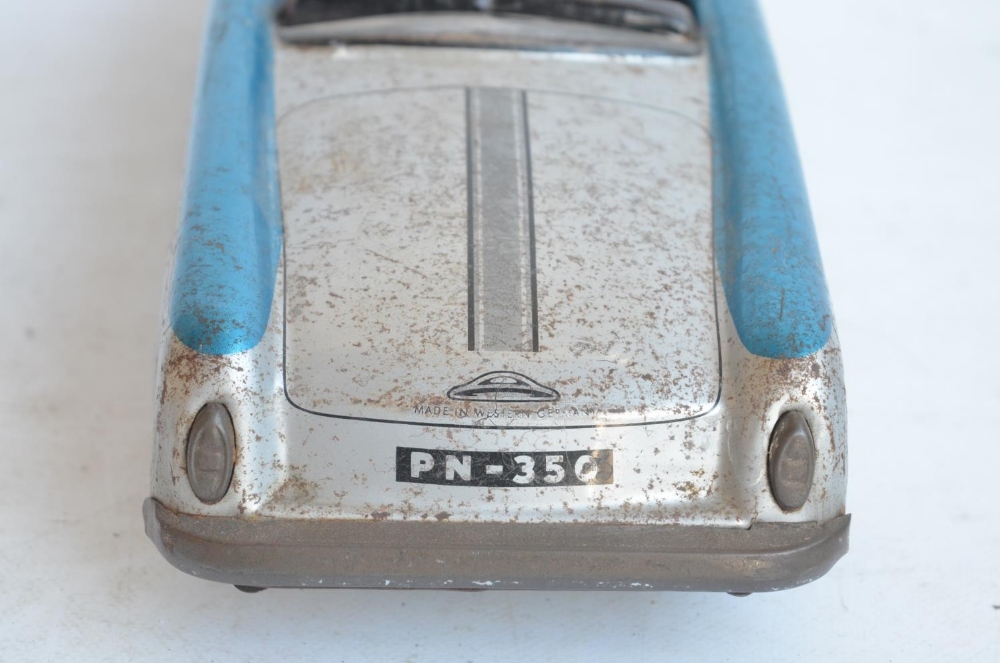 WITHDRAWN - Vintage West German lithographed pressed steel push along friction powered car model wi - Image 3 of 7