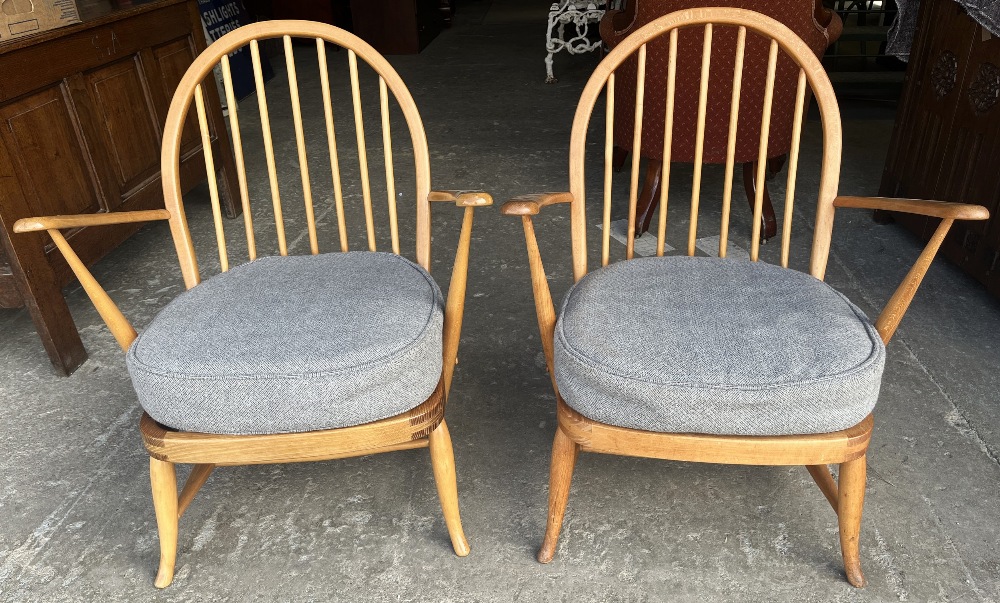 Pair of Ercol hoop and stick back arm chairs, with loose seat cushions on turned outsplayed