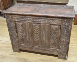 18th century French oak side cabinet, hinged top above two doors carved with strapwork, W129cm D63cm
