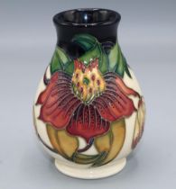 Moorcroft Pottery, Anna Lily pattern small vase, designed by Nicola Slaney, H9.5cm