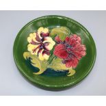 Moorcroft Pottery, Hibiscus pattern plate, D22cm