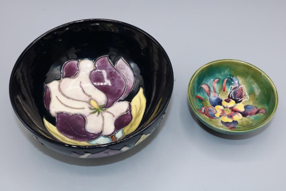 Moorcroft Pottery, small Columbine design trinket bowl, D9cm, and a Magnolia pattern bowl, D16cm (2)