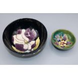 Moorcroft Pottery, small Columbine design trinket bowl, D9cm, and a Magnolia pattern bowl, D16cm (2)