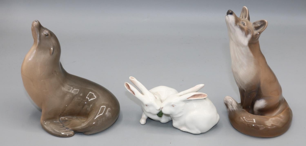 Royal Copenhagen figures of a fox, sealion, and two rabbits, numbered 1475, 1441, and 065