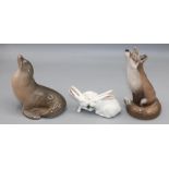 Royal Copenhagen figures of a fox, sealion, and two rabbits, numbered 1475, 1441, and 065