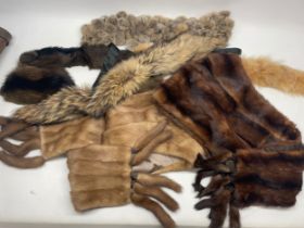Two brown fur stoles with mink tails, one labelled Walter Kerner, three fur scarves, and a mink
