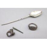 Hellenistic Greek silver insect ring, a Byzantine silver spoon, fragments of a pin brooch. (Victor