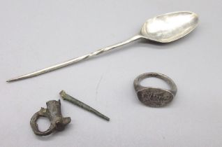 Hellenistic Greek silver insect ring, a Byzantine silver spoon, fragments of a pin brooch. (Victor