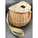 Vintage wicker fly-fishing basket in excellent condition, with leather fasteners and a canvas