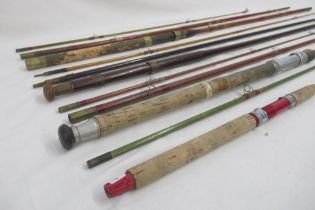 Selection of four vintage fishing rods, all with signs of age-related wear. To include two