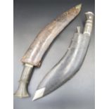 A Buffalo-horn-handled Kukri with decorative lion's head, complete with original sheath. Missing one