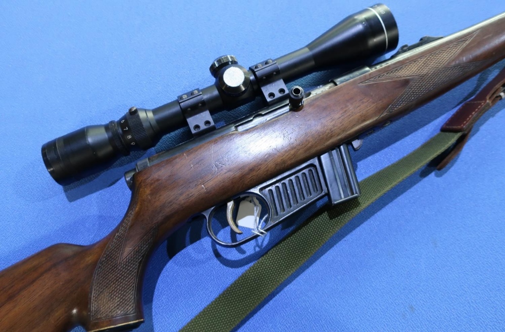 Voere .22 LR semi auto rifle, fitted with sound moderator and 3-9x40 scope, complete with rifle