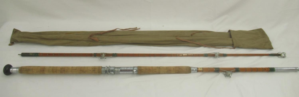 A vintage unmarked split cane pier/boat rod with cork handle, awarded News of the World 'rod of