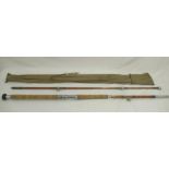 A vintage unmarked split cane pier/boat rod with cork handle, awarded News of the World 'rod of